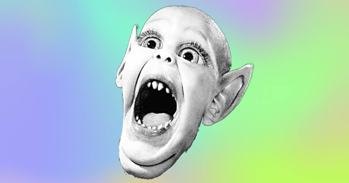 Black and white photo of a young boy with fants and elongated, pointy ears, against a blue and green background.